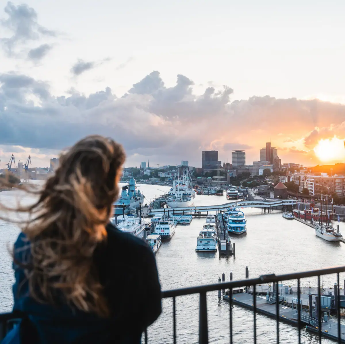 A woman looks at a city outdoors.