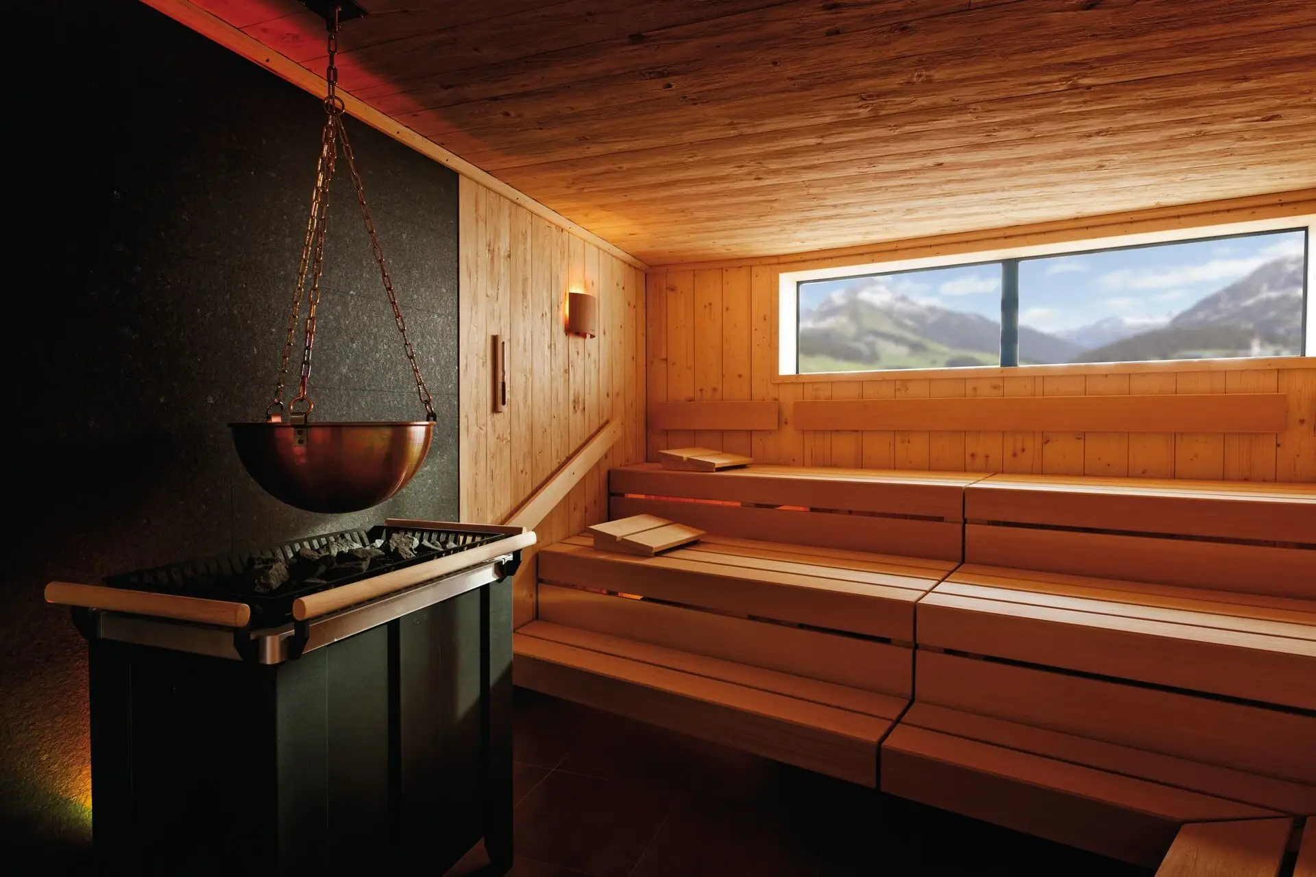 Log cabin sauna at aja Warnemünde Sauna with large bowl over a hot pool