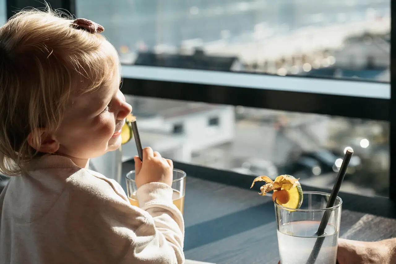 A child drinks from a straw.