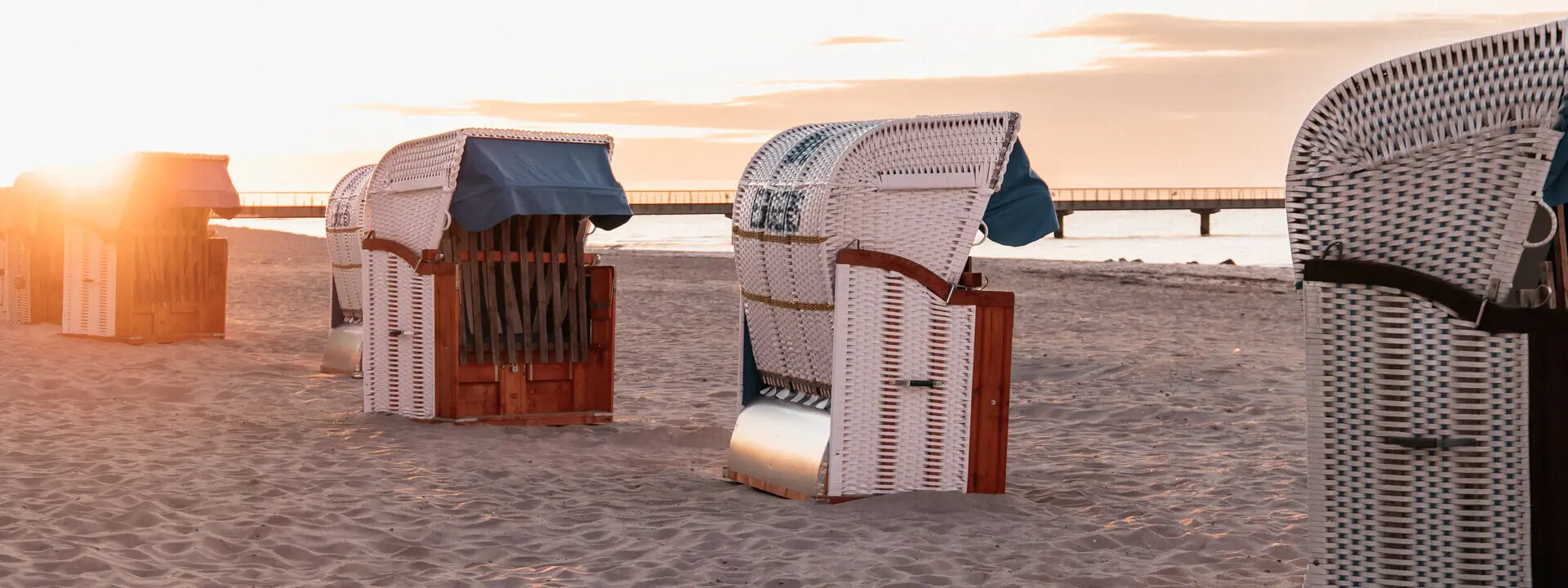 A group of beach chairs on the beach.