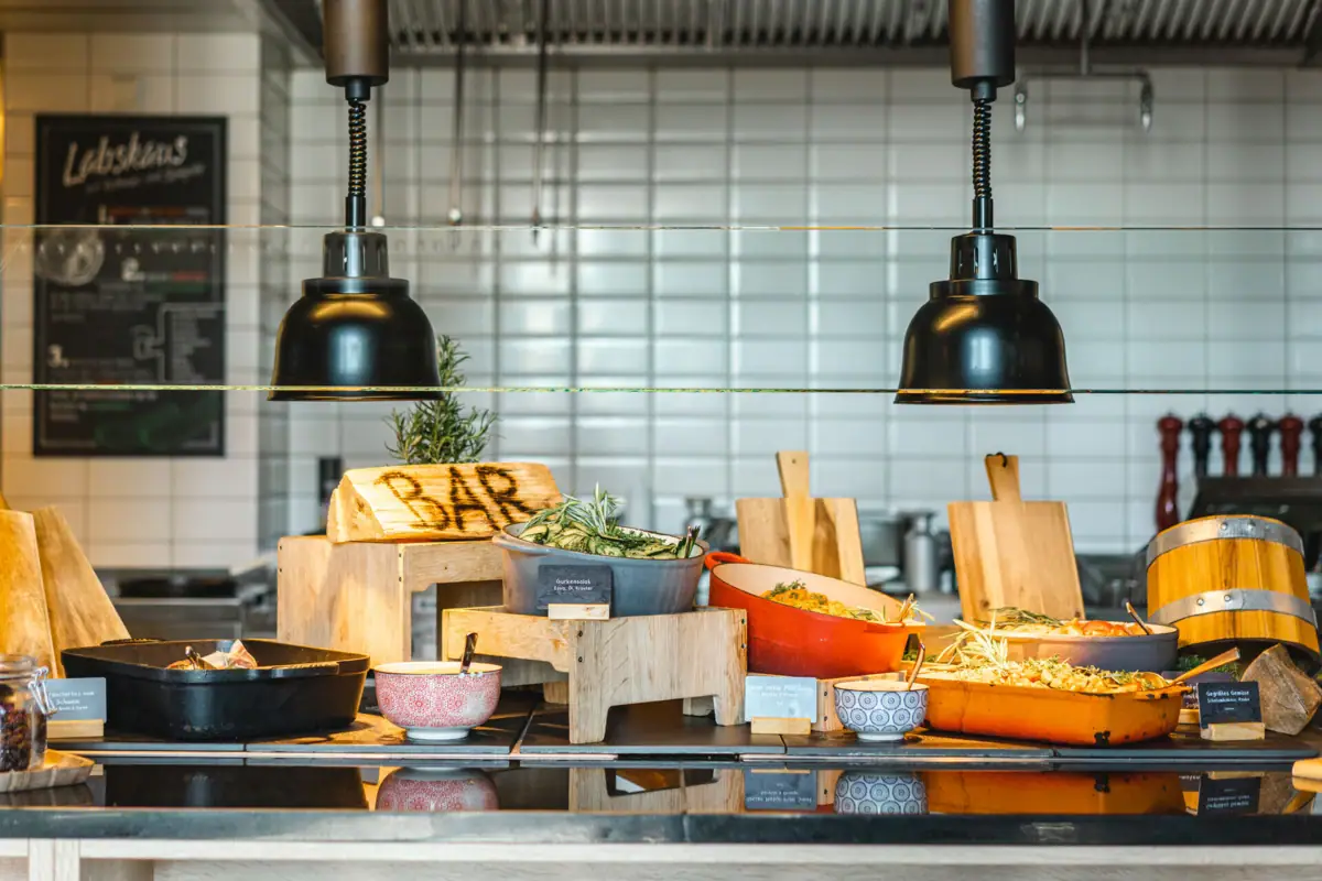 Buffet with bowls full of warm dishes.