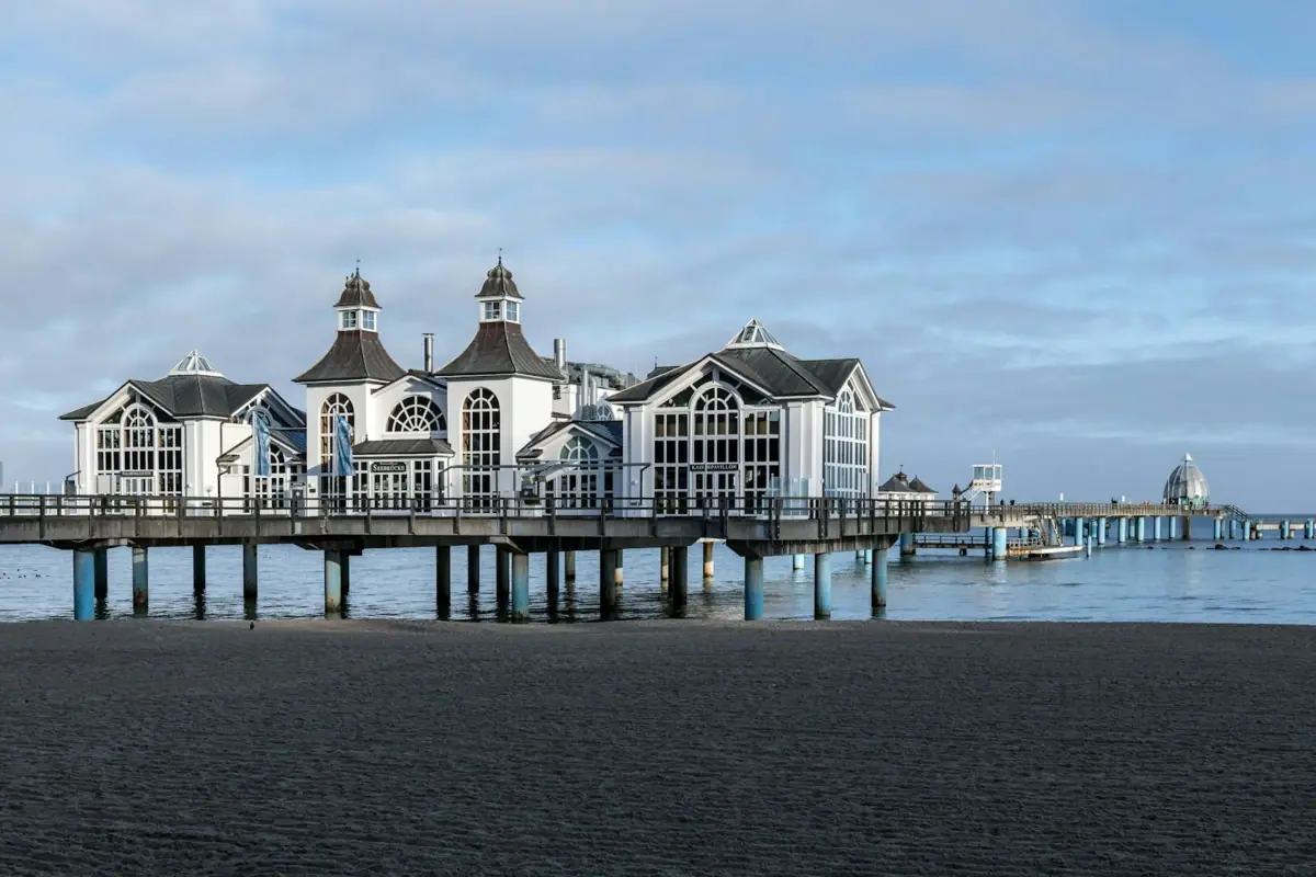 A building on a quay by the water.