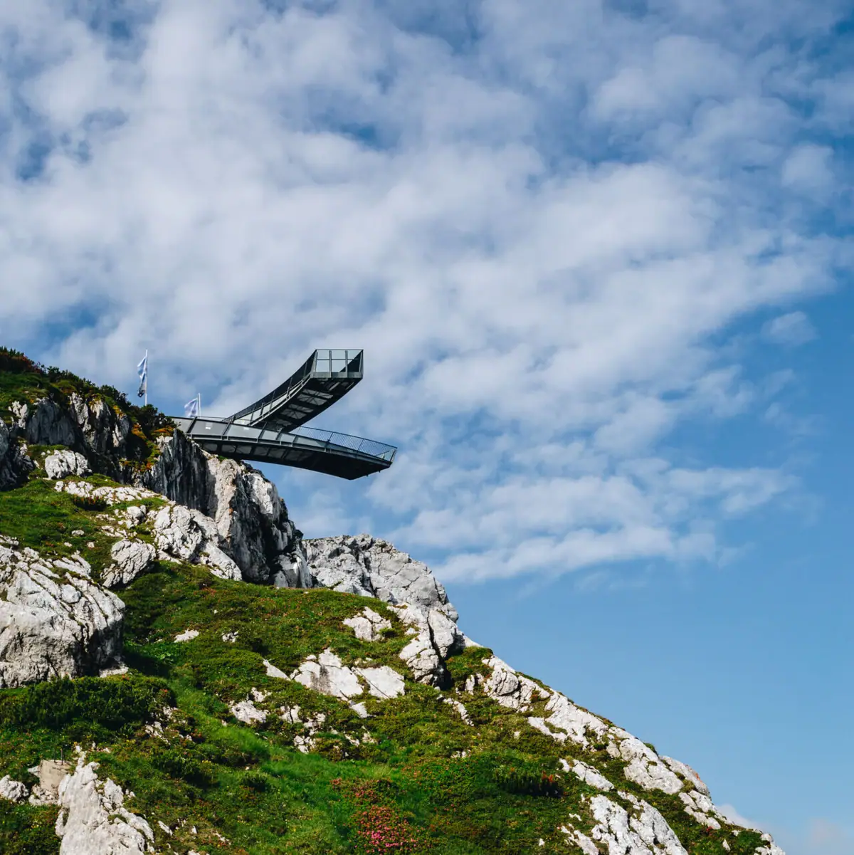 A bridge over a cliff in a natural landscape.