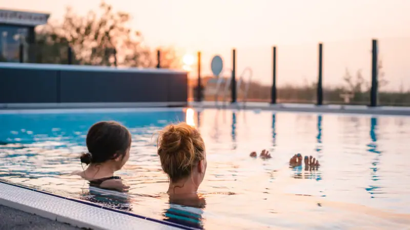 Outdoor pool at the aja Warnemünde Two women in a pool.