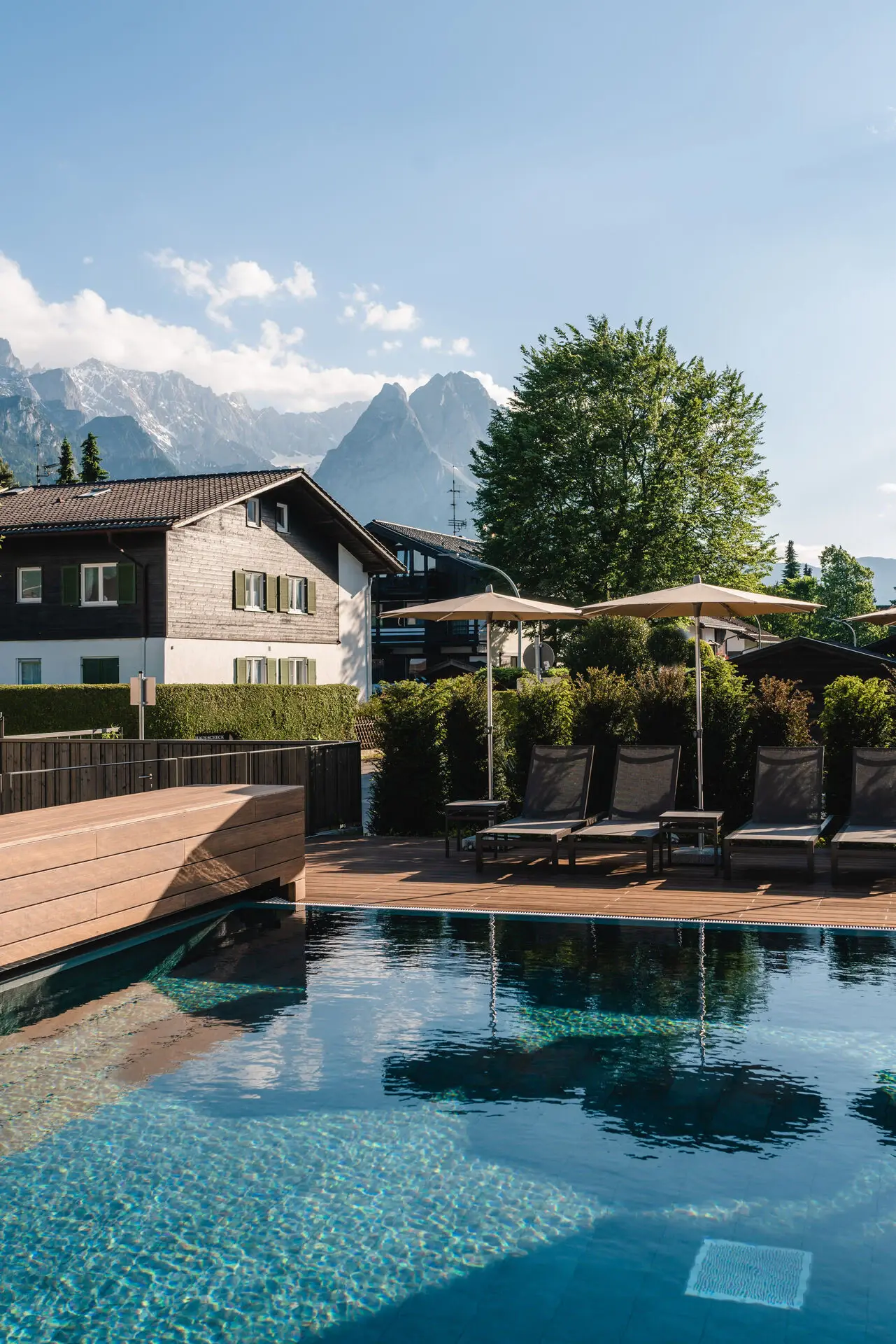 Outdoor swimming pool adjacent to a building