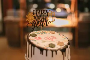 A cake with a "Happy New Year" sign.