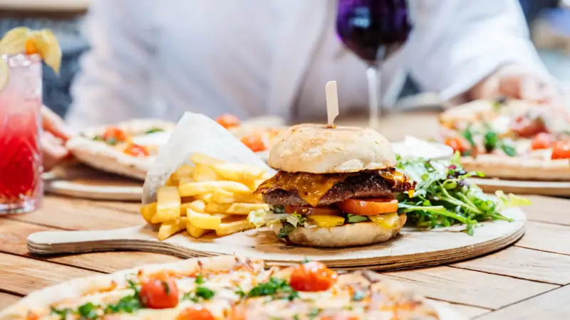 A burger and fries on a plate.