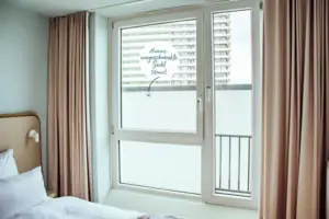 aja economy room A window with a white sign on it.