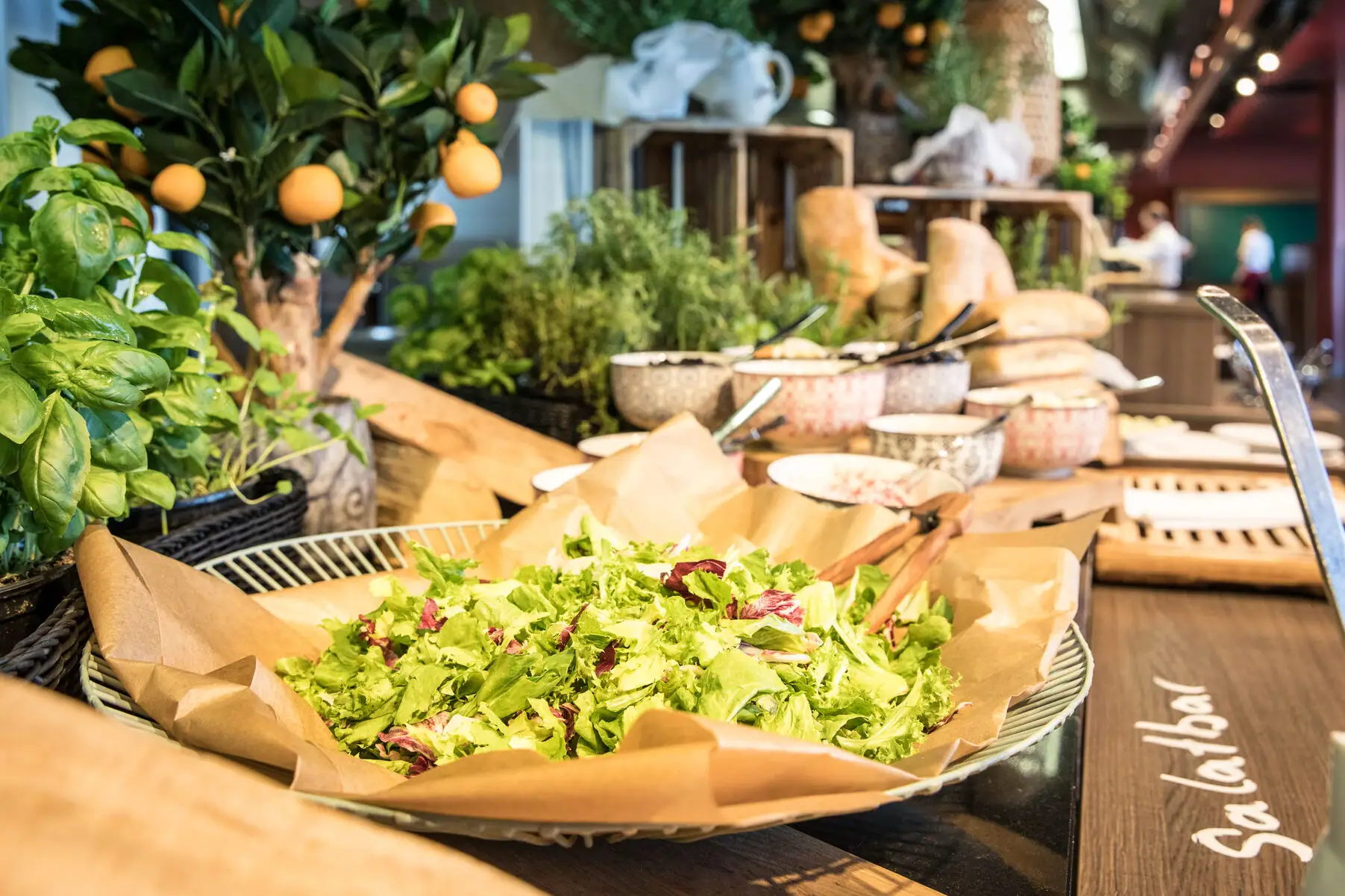 A bowl of salad on a table.