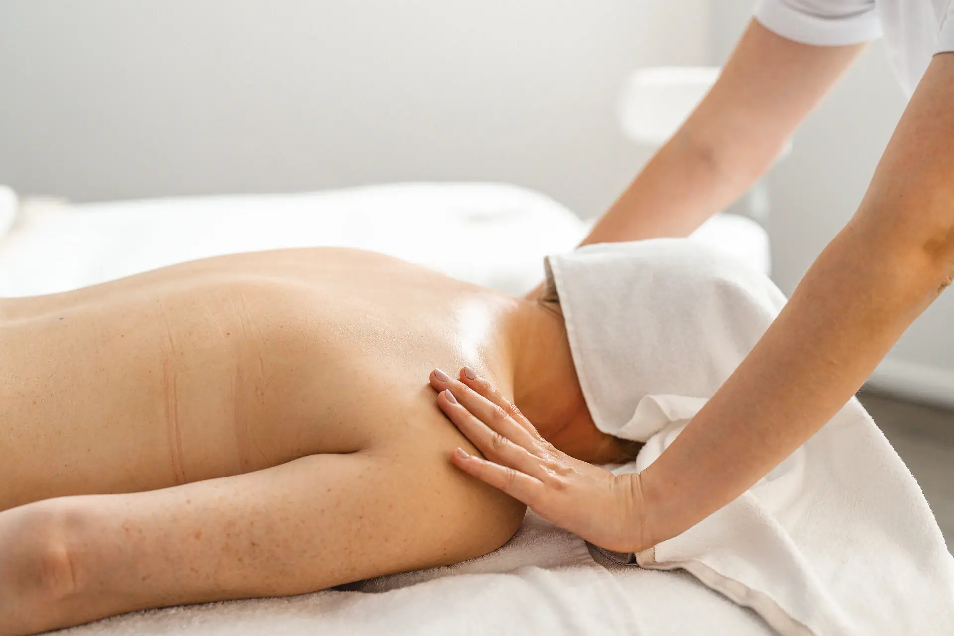 Massage Person receives a back massage.