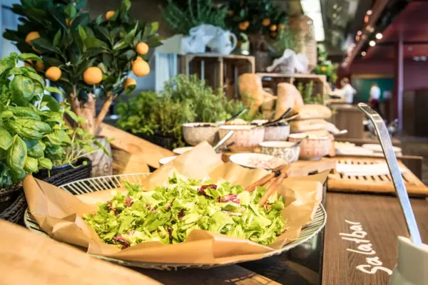 Buffet at JEDERMANNS A bowl of salad on a table