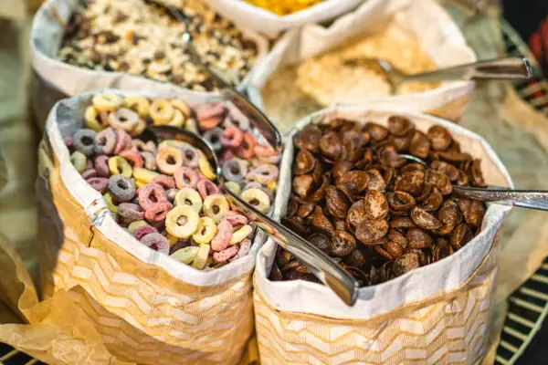 A group of cereal bags with spoons.
