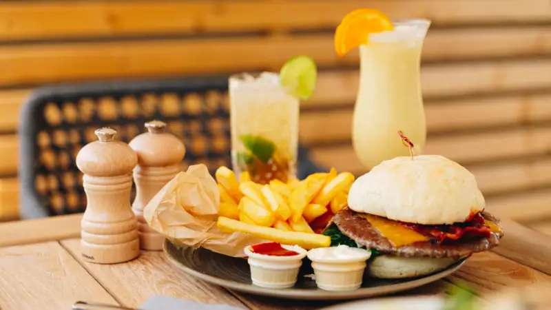 A plate of fast food on a table.