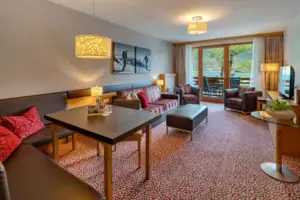 Suite A room with a table and chairs.