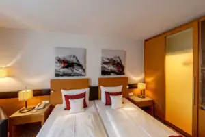 Double room A room with two beds and paintings on the wall.