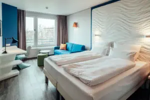 A room with a bed and a sofa.