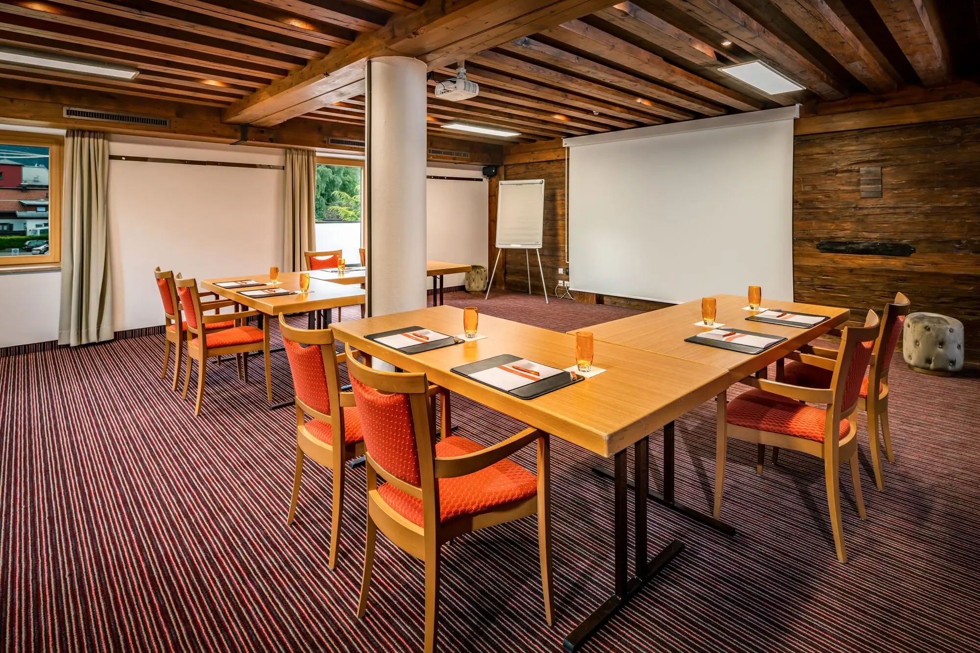 A room with a table and chairs.