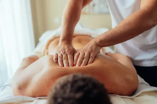 A person is having a back massage.