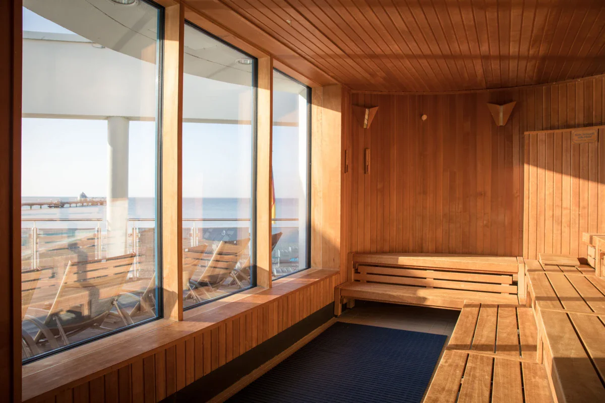 A sauna with wooden walls and windows.