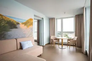 Suite A living room with a sofa and chairs.