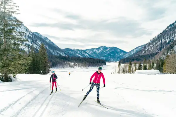 Cross-country skiing in Ruhpolding A group of people skiing in the snow.