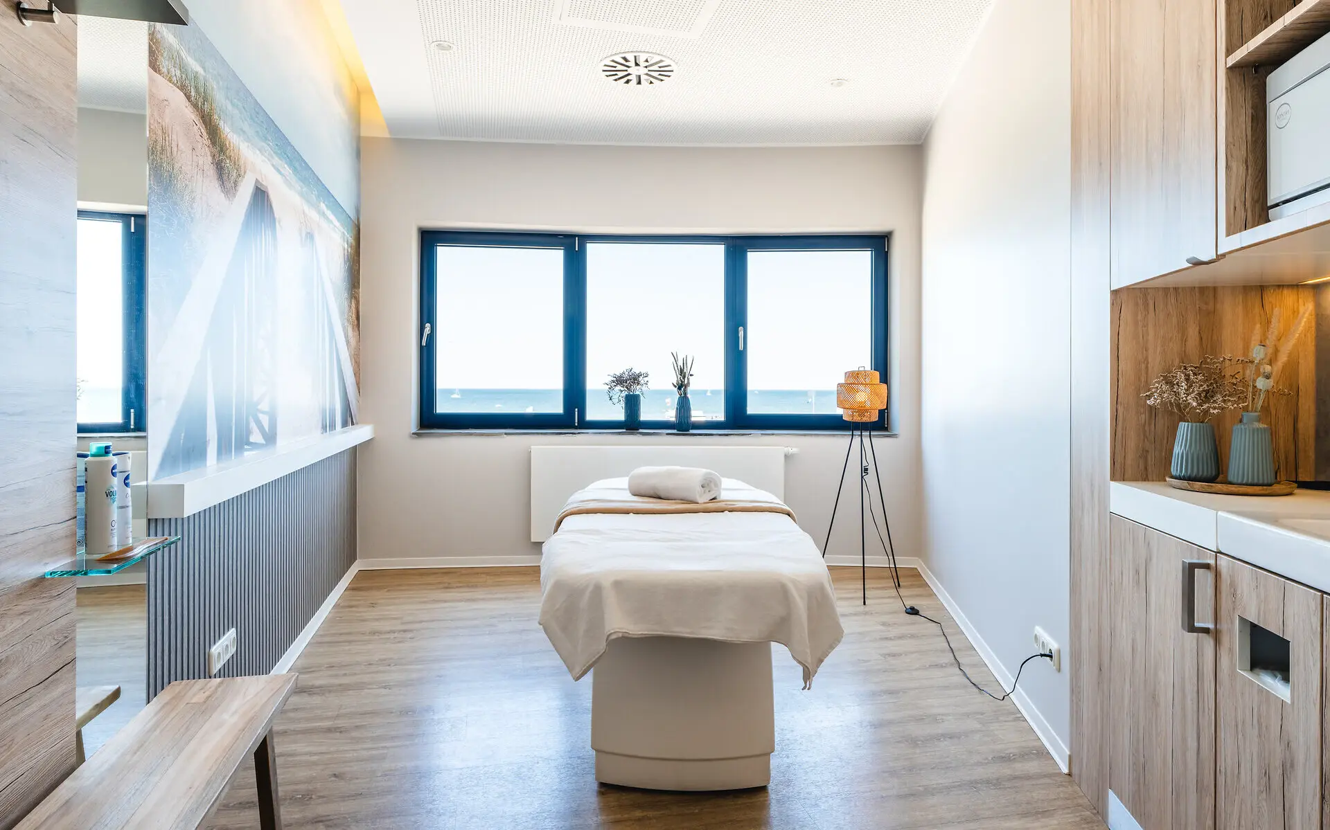 Massage table in a well-appointed room with modern interior design elements.