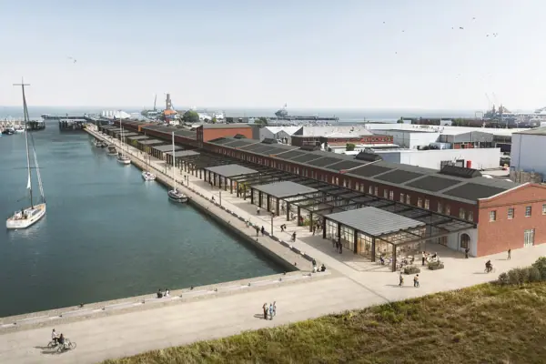 A dock with a building and a body of water
