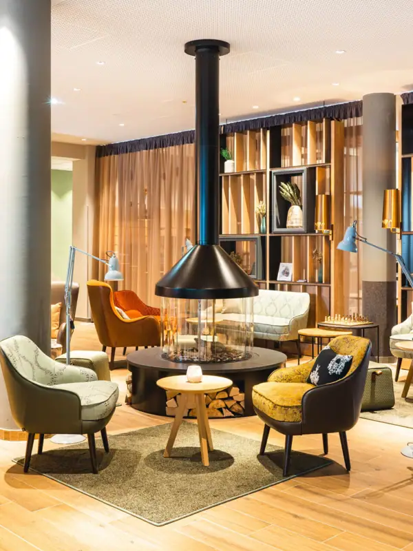 Fireplace A room with a fireplace and chairs.