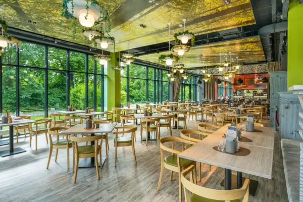 A room with tables and chairs.