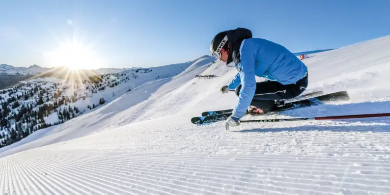 Person skiing on a snowy slope.