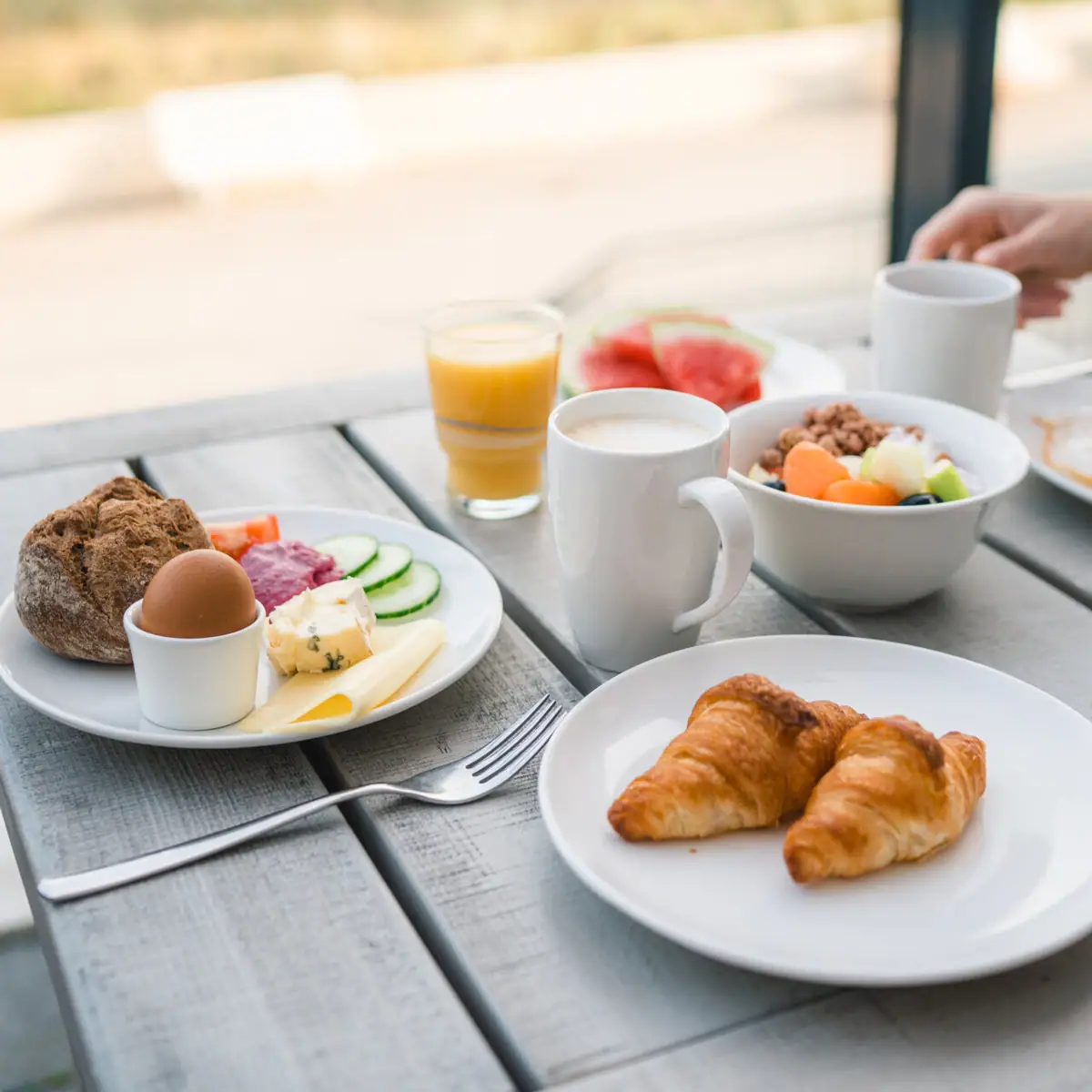 A table with various dishes and crockery.
