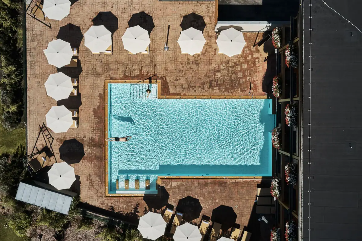 A person swims in a pool.