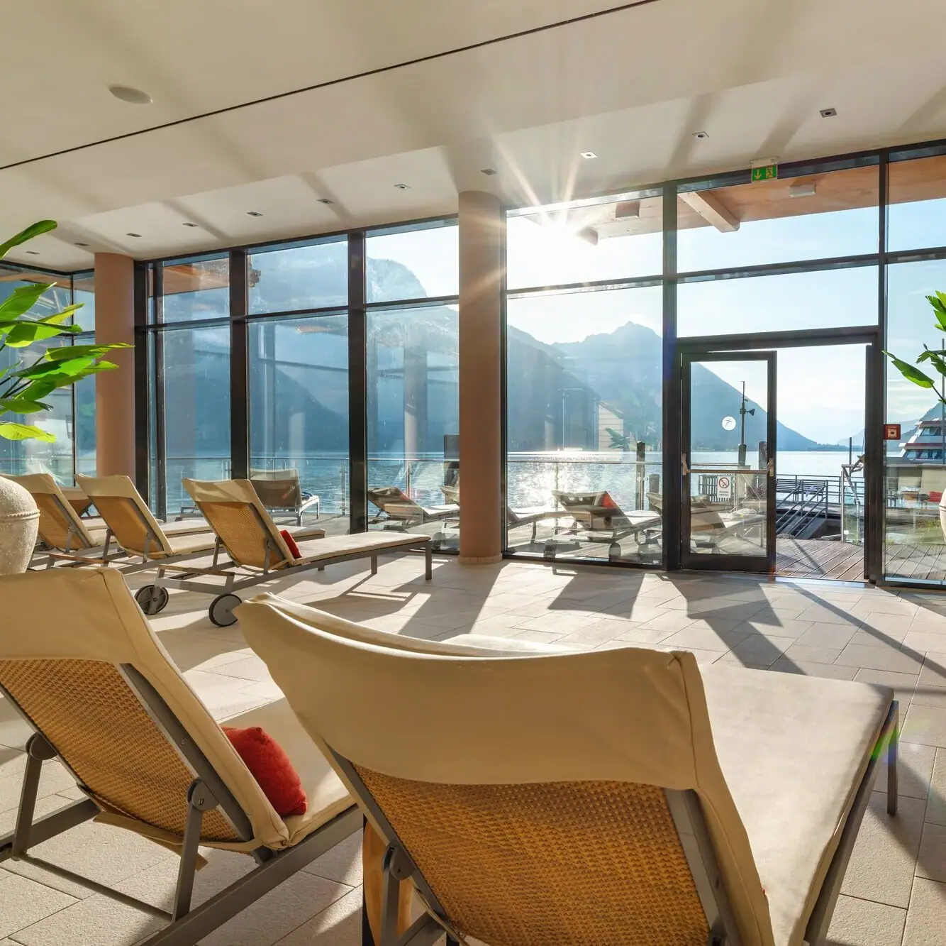 SPA at Lake Achensee A room with chairs and a large glass door.
