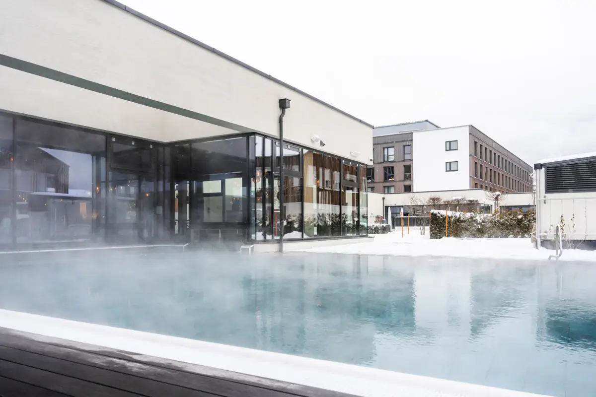 Outdoor pool A steaming outdoor pool under a clear sky.
