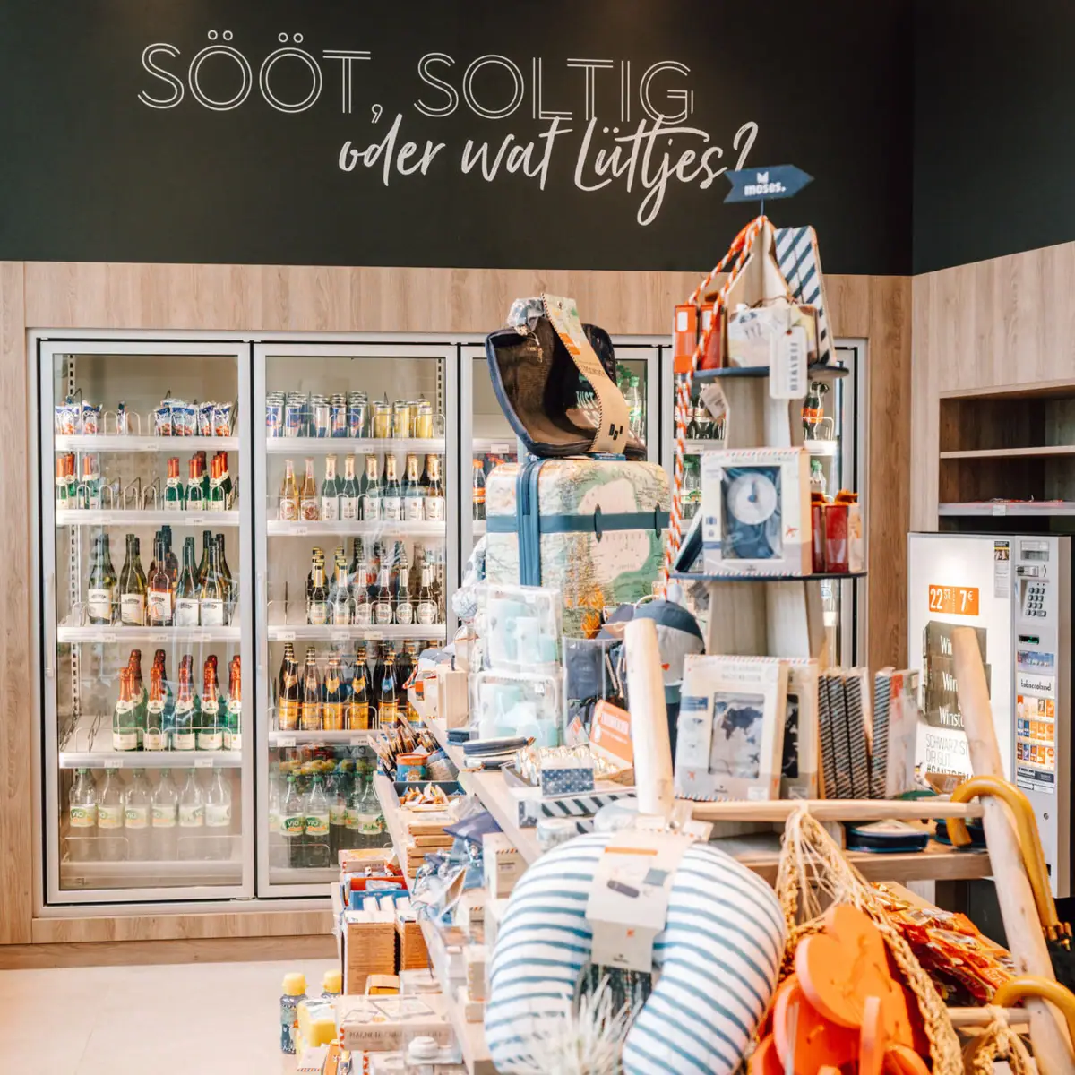 A shop with shelves full of drinks and a sign.