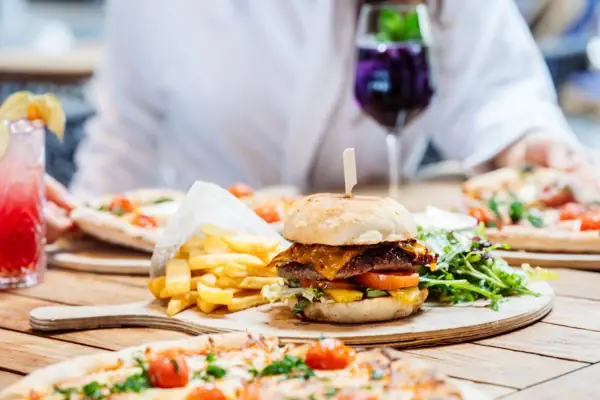 Burgers A burger and chips on a plate.