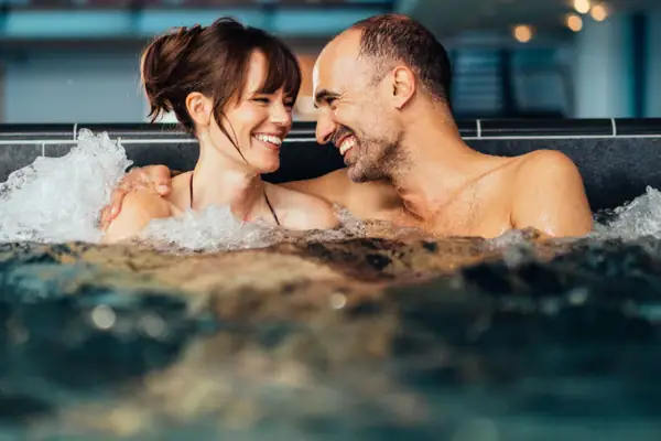 A man and a woman in a whirlpool.