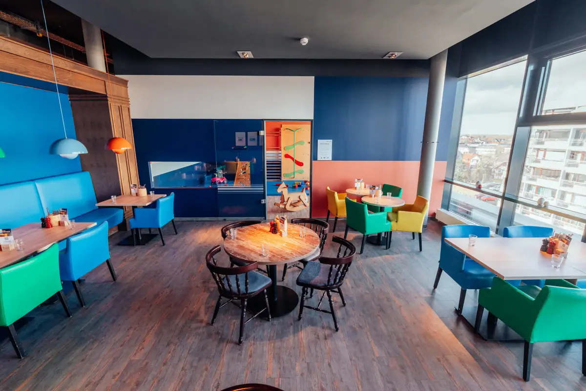 A room with tables and chairs.