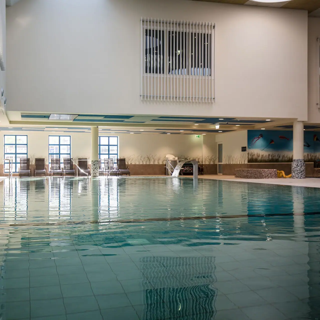 Large indoor pool with clear water.