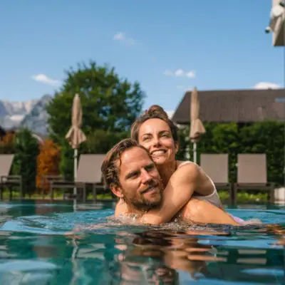 A man and a woman in a swimming pool.