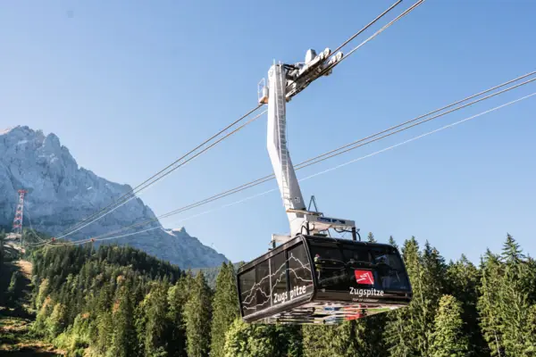 The Zugspitze as an attraction in Garmisch-Partenkirchen with the Zugspitze railway leading up the mountain.