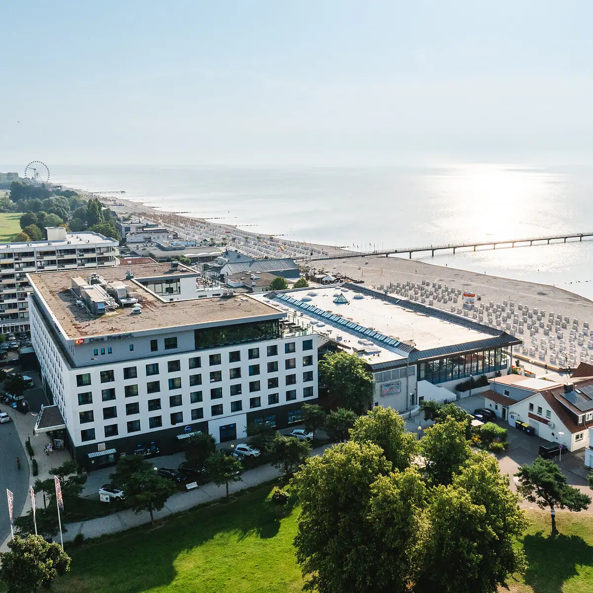 A building next to a body of water in the open air.