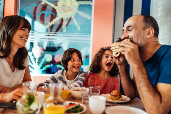 A group of people are eating at a table.