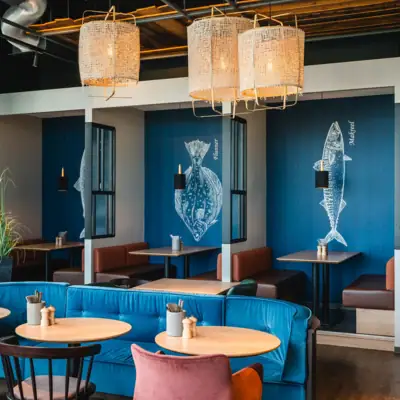 A room with tables and chairs.