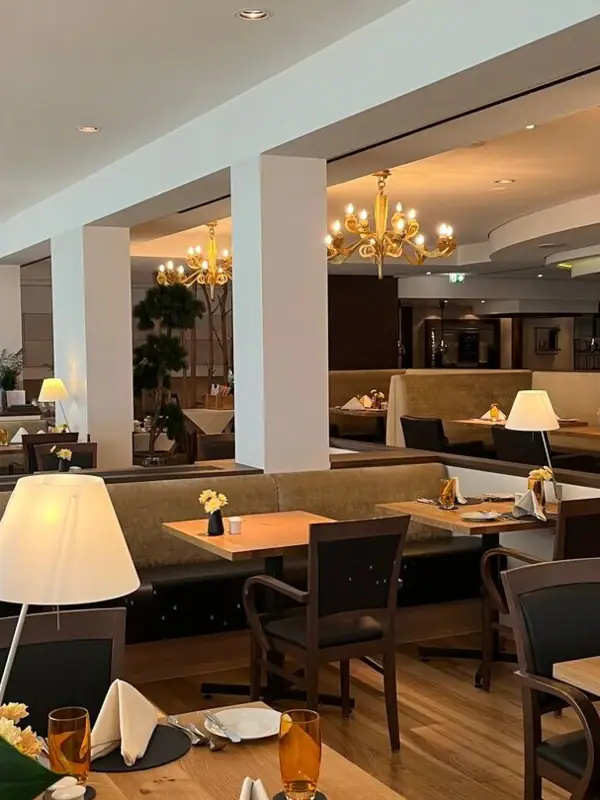 Restaurant A restaurant with tables and chairs inside.