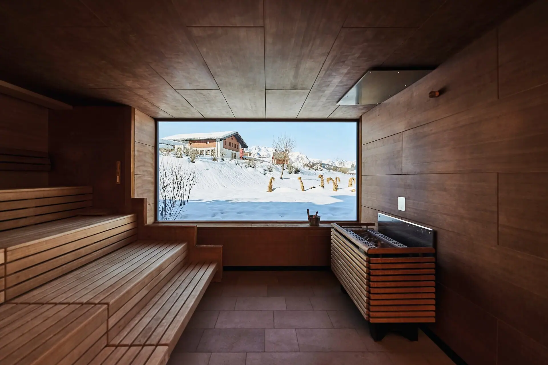 A sauna with a window and benches.
