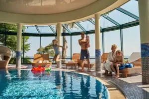 A group of people at a swimming pool.