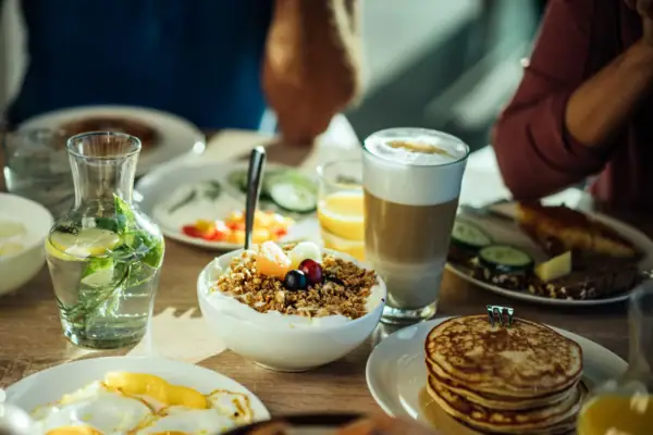 A table with various dishes and drinks.