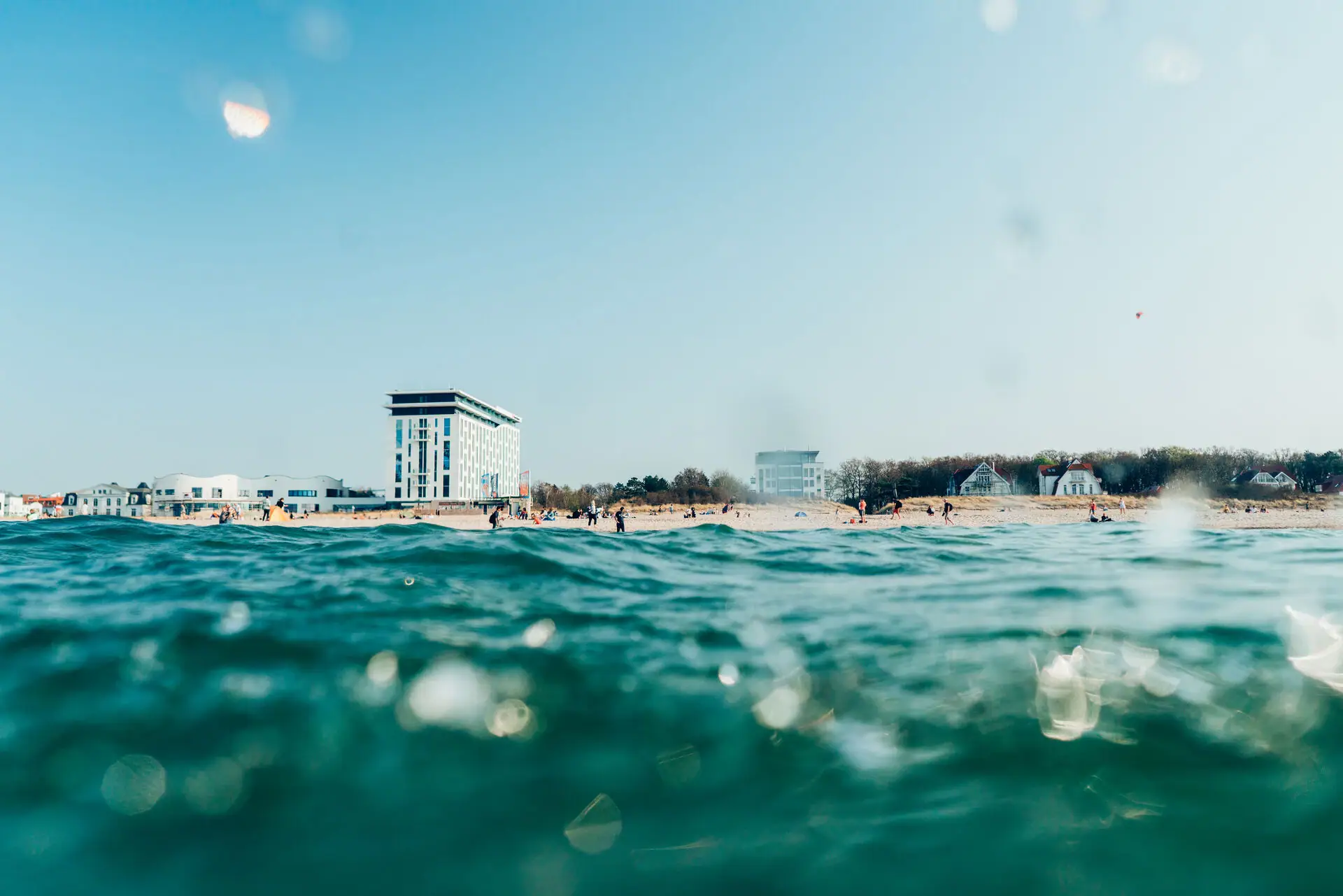 Water with the aja Warnemünde in the background.