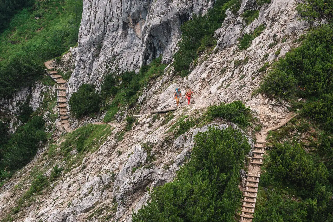 Mountaineering A group of people hiking on a rocky mountain.